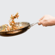 Illustration for article titled How to toss food in a pan like a cool pro chef